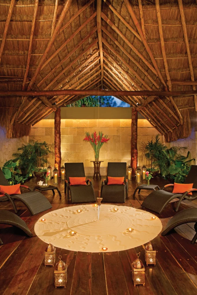 Indoor spa relaxation area with lounge chairs and tranquil ambiance at Dreams Sapphire Resort & Spa.