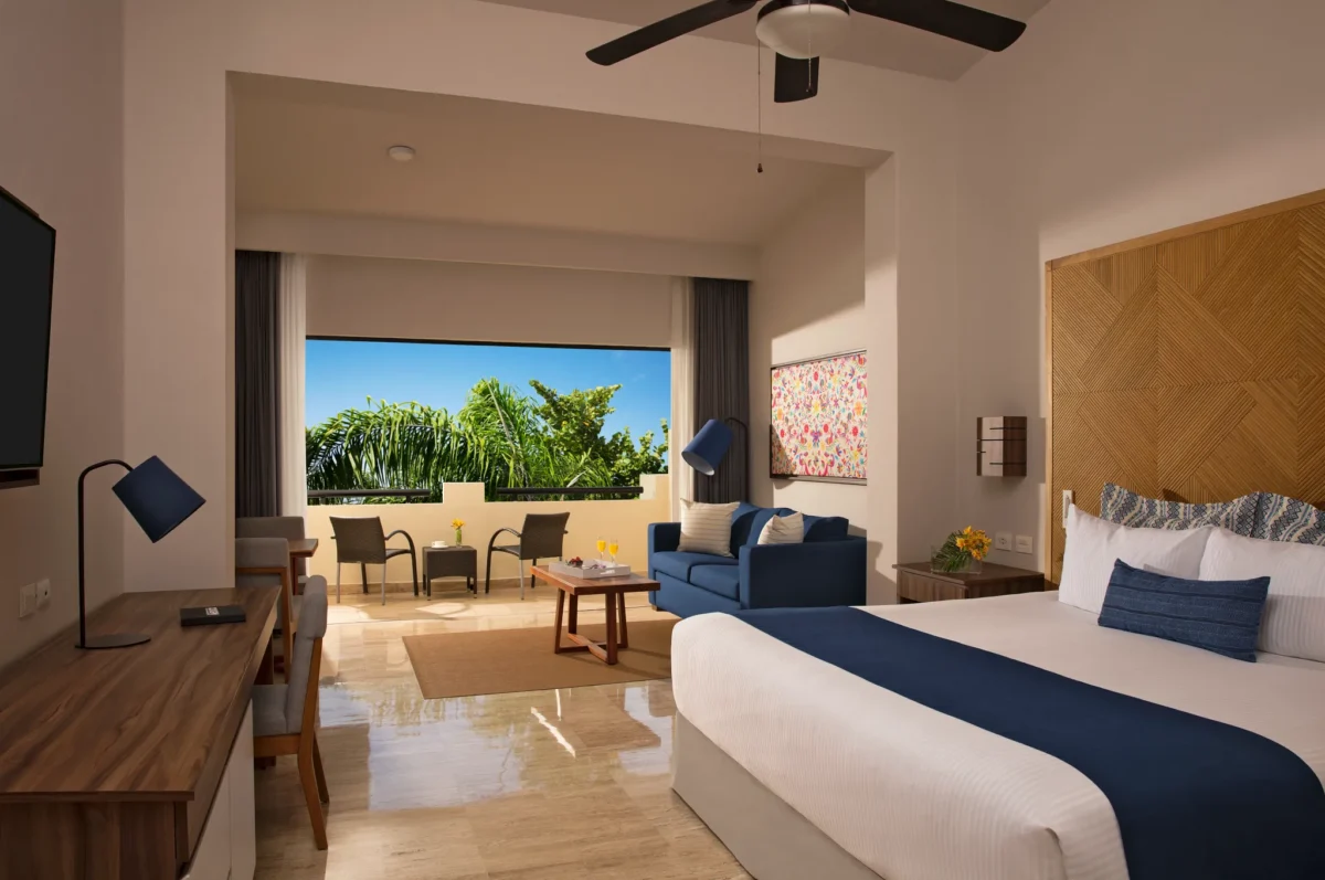 Preferred Club Junior Suite Tropical View with king bed and private balcony at Dreams Sapphire Resort & Spa.