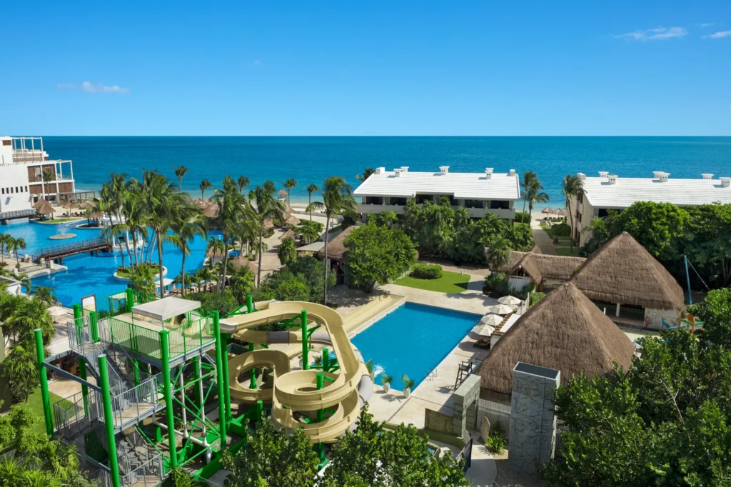 Waterslide complex near the main pool at Dreams Sapphire Resort & Spa offering exciting family-friendly attractions.