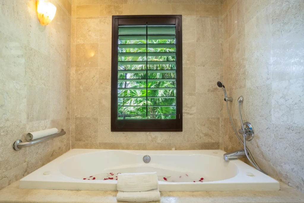 Deluxe Junior Garden View hot tub bathroom at Dreams Tulum Resort & Spa.