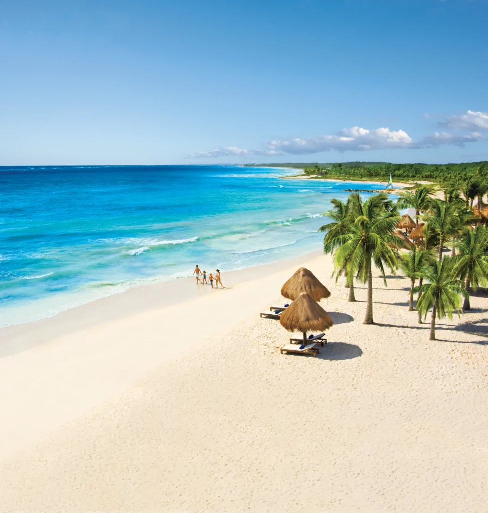 White-sand beach and turquoise Caribbean waters at Dreams Tulum Resort & Spa in Riviera Maya.