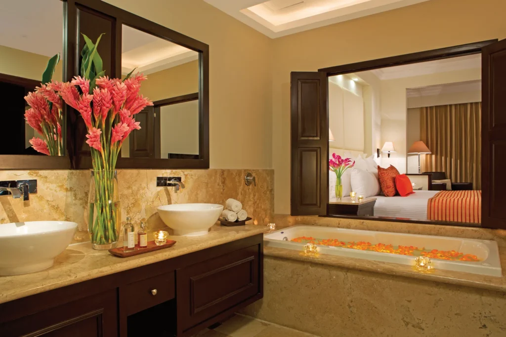 Family Suite Deluxe Garden View marble bathroom with soaking tub and double vanity at Dreams Tulum Resort & Spa.