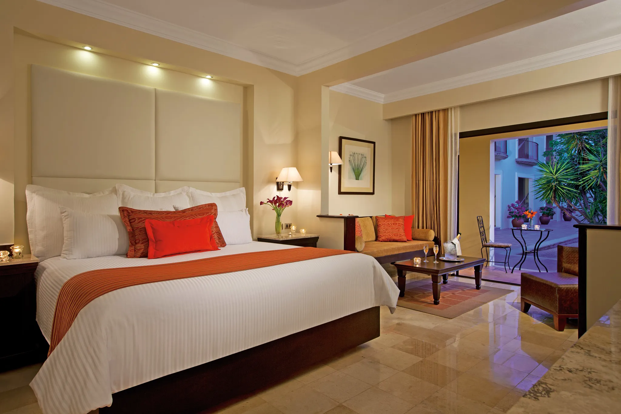 Family Suite Deluxe Garden View junior-style bedroom with king bed at Dreams Tulum Resort & Spa.