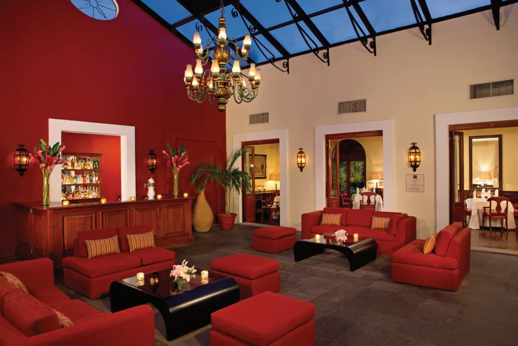 The Lounge at Dreams Tulum Resort & Spa featuring stylish indoor seating, handcrafted cocktails, and an inviting atmosphere for socializing and relaxation.