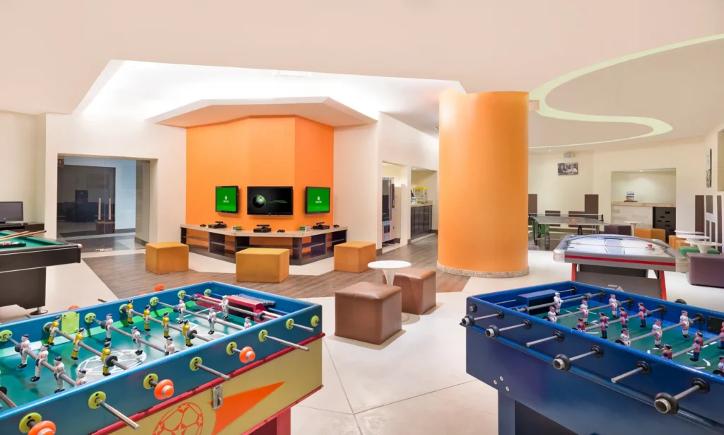 Core Zone Teens Club game room with foosball tables and gaming area at Dreams Vallarta Bay Resort & Spa.