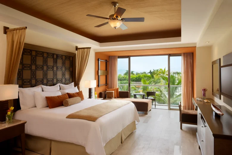 Junior Suite Garden View King with private balcony at Dreams Vallarta Bay Resort & Spa.