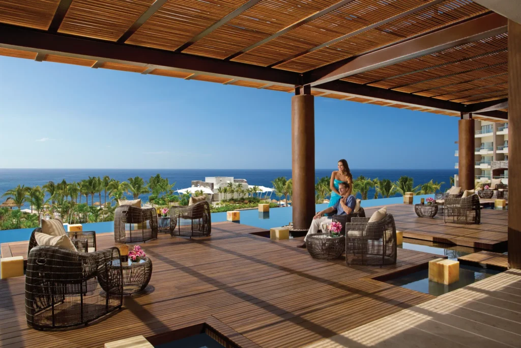 Beachfront with palapas and Banderas Bay views at Dreams Vallarta Bay Resort