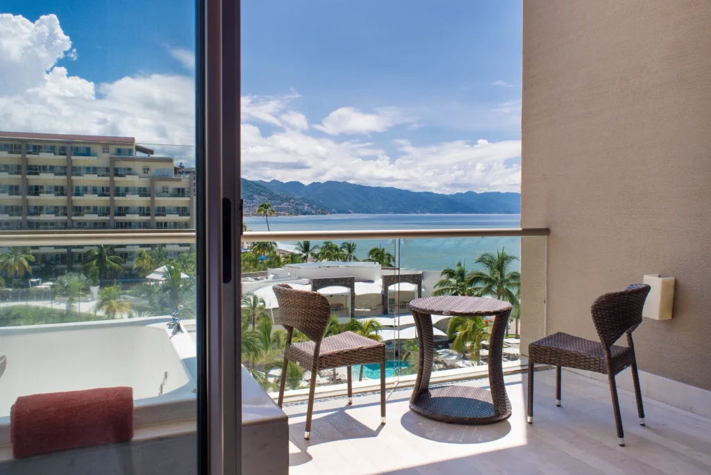Preferred Club Junior Suite Ocean View balcony with hot tub at Dreams Vallarta Bay Resort & Spa.