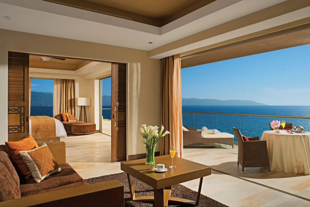 Preferred Club Master Suite Oceanfront living room and terrace with ocean views at Dreams Vallarta Bay Resort & Spa.
