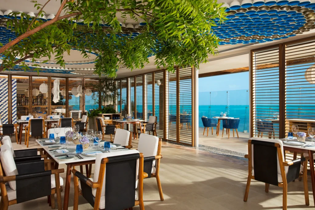 Bluewater Grill at Dreams Vista Cancun featuring elegant indoor dining, Mediterranean fusion cuisine, and panoramic Cancun skyline views.