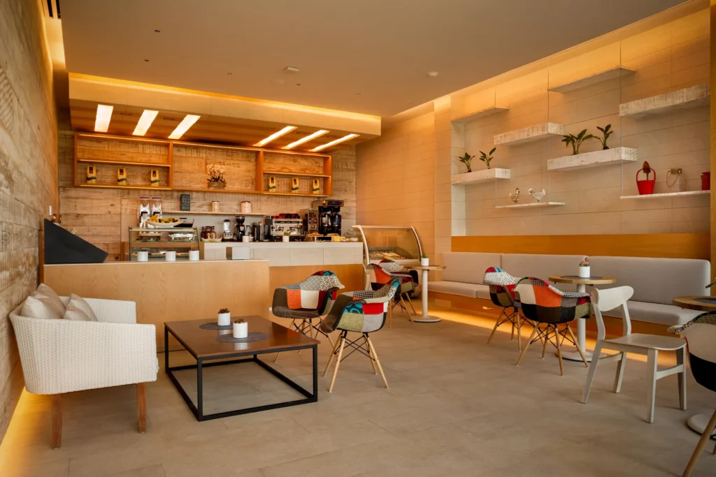 Coco Cafe at Dreams Vista Cancun featuring a cozy coffee shop setting with premium espresso, pastries, and ice cream near ocean views.