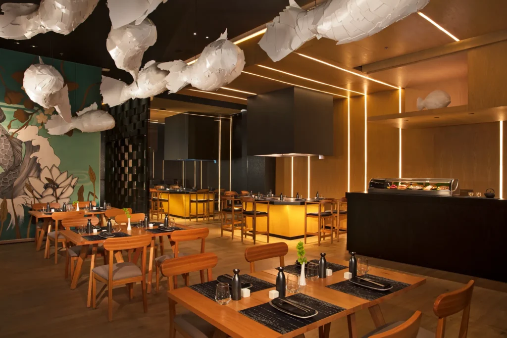 Himitsu Pan-Asian restaurant at Dreams Vista Cancun featuring a stylish dining space, fresh sushi bar, and contemporary Asian-inspired design.
