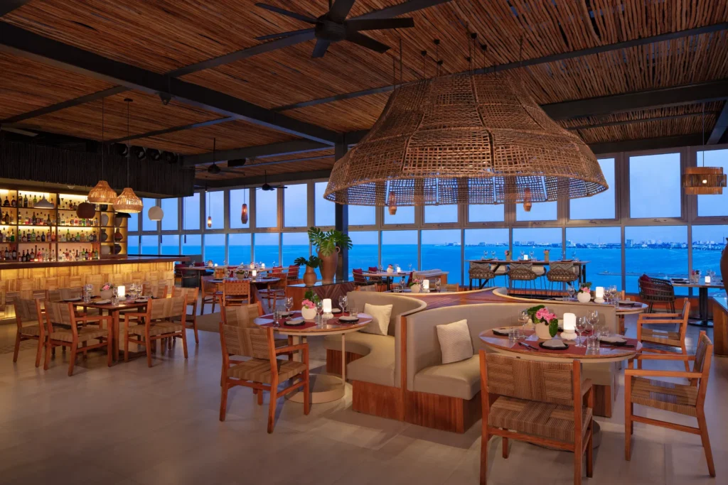 Vista Prime rooftop asado grill at Dreams Vista Cancun featuring open-air dining, grilled specialties, and panoramic Cancun skyline views.