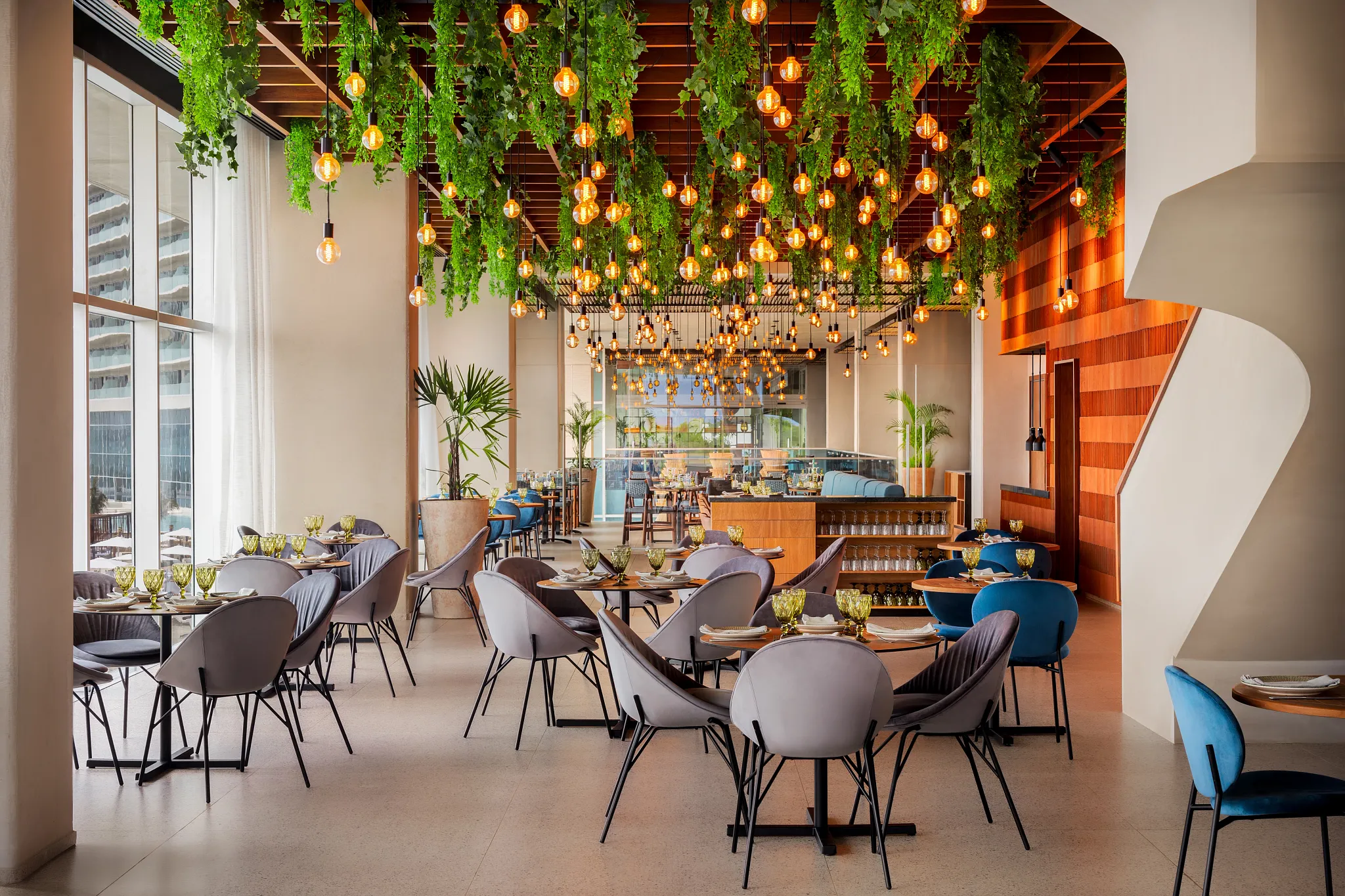 Aglio Italian restaurant at Hyatt Vivid Grand Island serving gourmet Italian dishes and brick-oven pizza in an elegant dining setting.