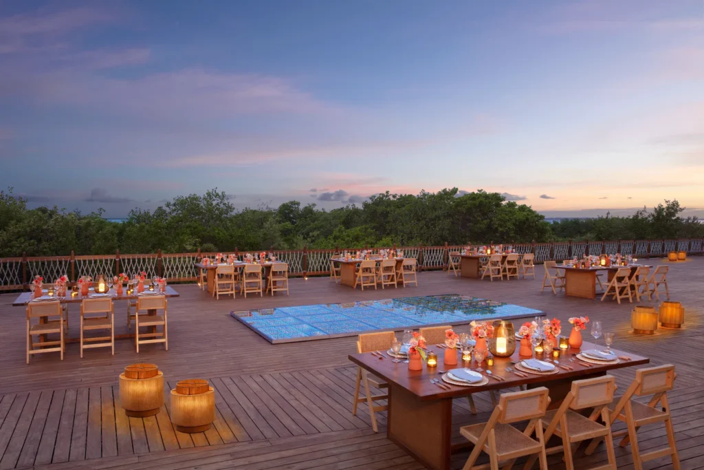 Amber Sunset Deck outdoor reception setup with lit dance floor at Hyatt Vivid Grand Island