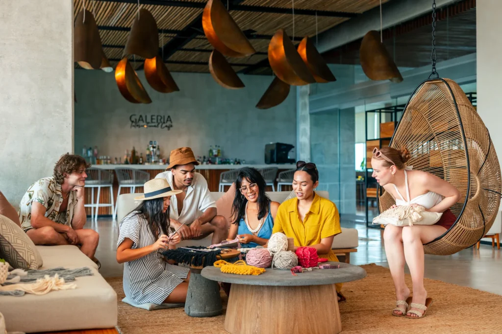 Guests participating in a macrame craft class inside a stylish lounge at Hyatt Vivid Grand Island.