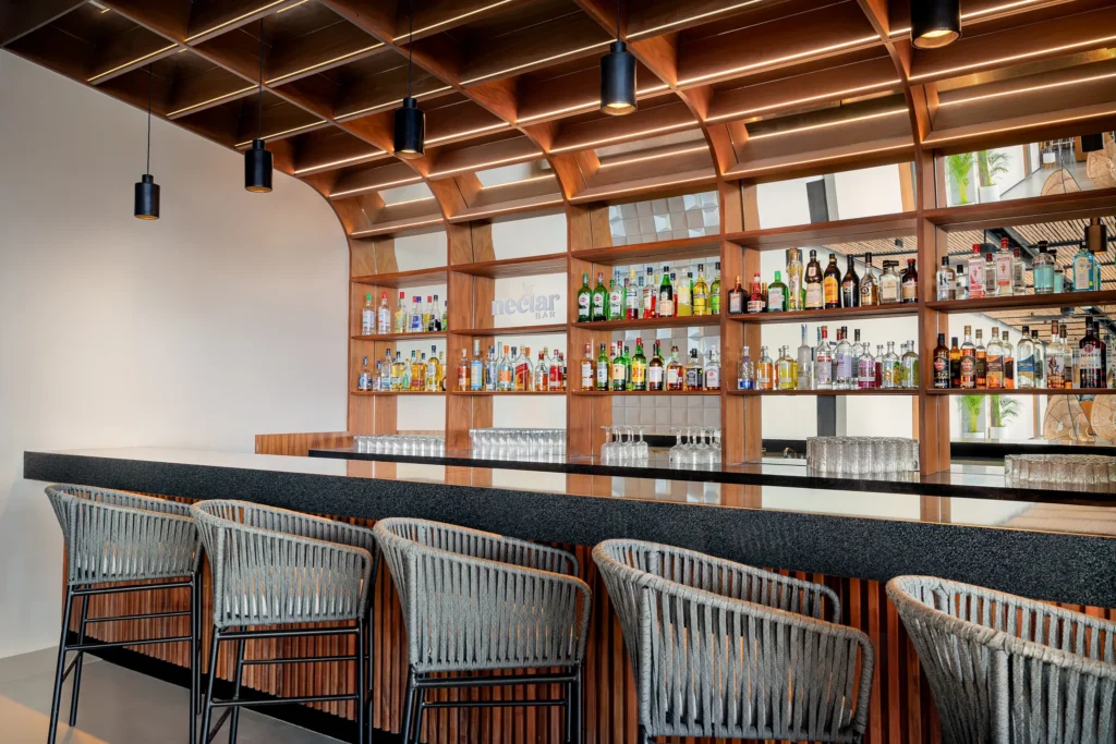 Nectar cocktail bar at Hyatt Vivid Grand Island offering handcrafted cocktails in a stylish lounge near Le Lys and Aglio restaurants.