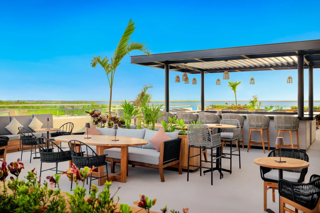 Serenity Bar & Terrace at Hyatt Vivid Grand Island featuring an elegant outdoor lounge with terrace seating, ambient lighting, and evening cocktails.