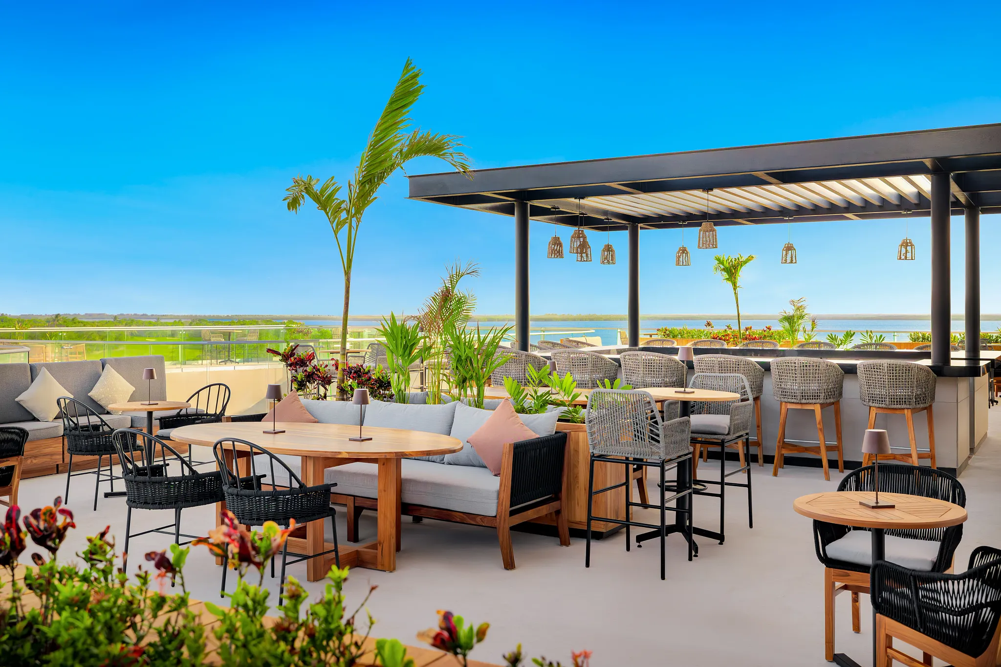 Serenity Bar & Terrace at Hyatt Vivid Grand Island featuring an elegant outdoor lounge with terrace seating, ambient lighting, and evening cocktails.