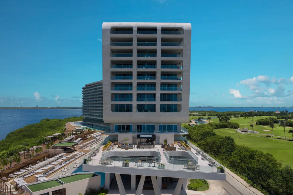 Serenity Bar terrace with modern poolside lounge overlooking ocean at Hyatt Vivid Grand Island