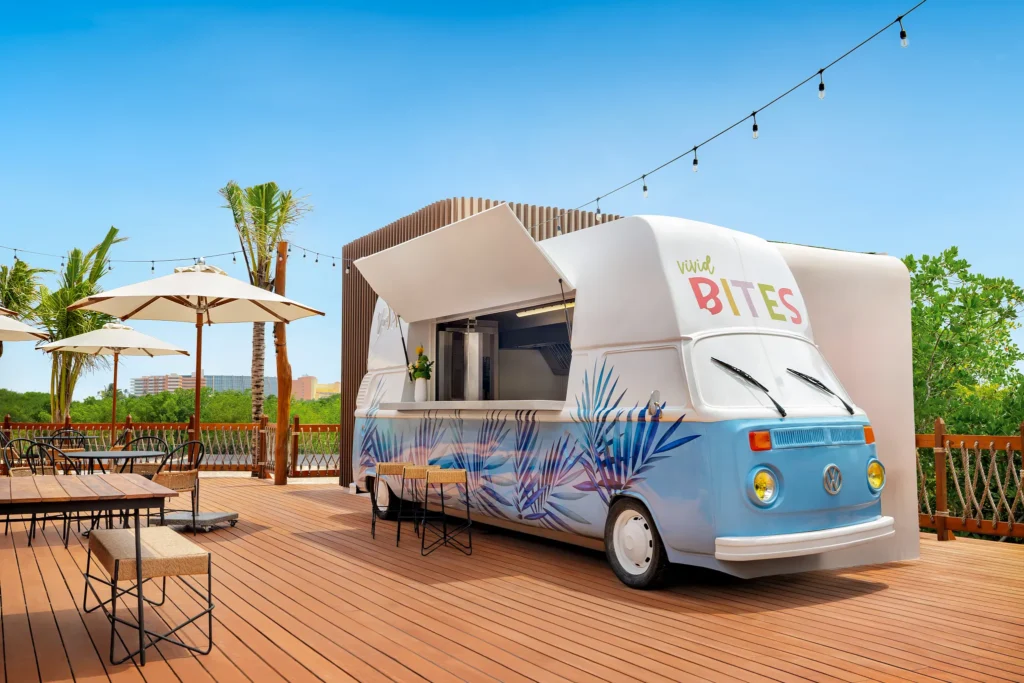 Vivid Bites food truck at Hyatt Vivid Grand Island serving Mexican favorites, burgers, and fresh casual bites in a relaxed outdoor setting.