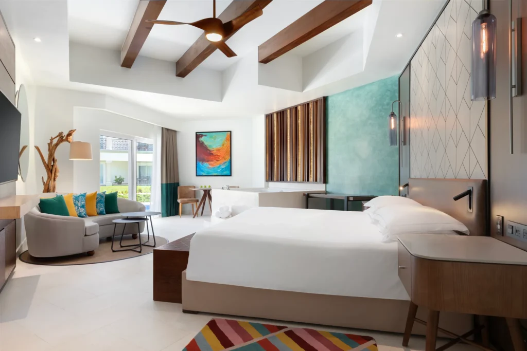 Junior Suite Swim-Up with king bed and jetted tub at Hyatt Vivid Playa del Carmen.