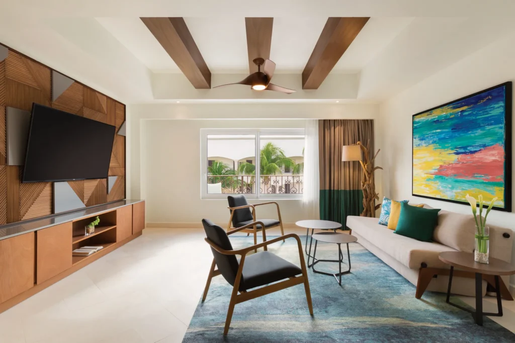 One Bedroom Suite King sitting area with dining space at Hyatt Vivid Playa del Carmen.