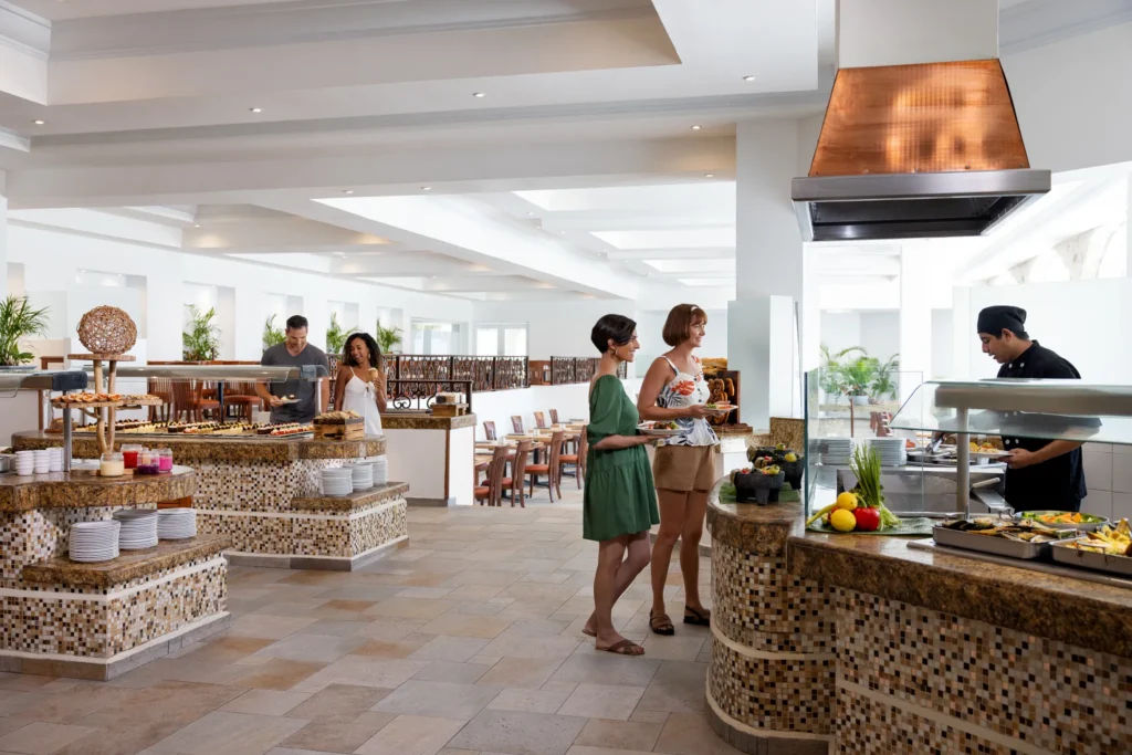 Spice restaurant at Hyatt Vivid Playa del Carmen featuring vibrant international cuisine, modern décor, and an inviting buffet-style dining atmosphere.