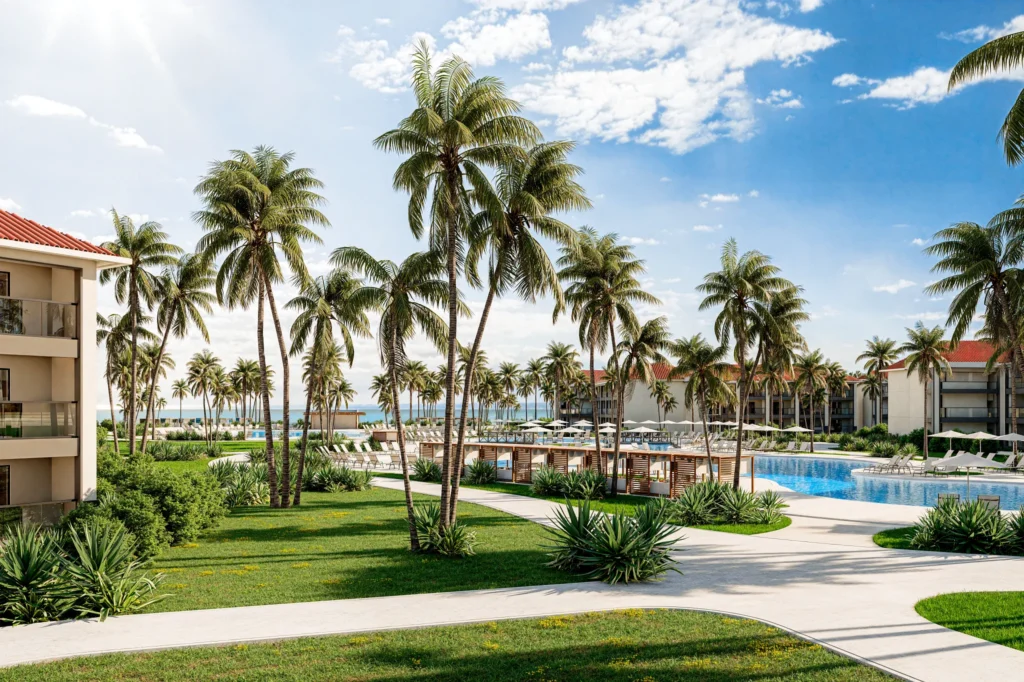 Resort pool area with palm trees, lounge chairs, and walking paths at Hyatt Vivid Punta Cana.