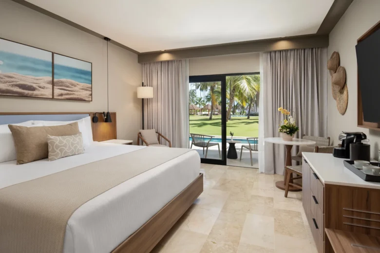 Vantage Club Suite Garden View Swim Out with king bed and terrace leading directly to pool at Hyatt Vivid Punta Cana.