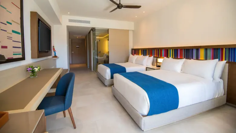 Club Oceanfront Junior Suite Double with two queen beds and oceanfront balcony at Hyatt Zilara Cap Cana.