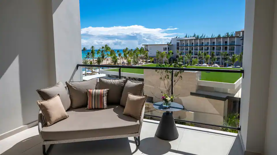 Private balcony seating area with ocean views from the Ocean View Junior Suite Double at Hyatt Zilara Cap Cana.