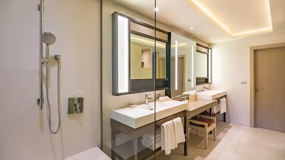 Ocean View Junior Suite Double bathroom with double vanity and separate shower at Hyatt Zilara Cap Cana.