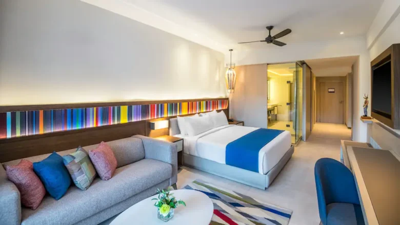 Ocean View Junior Suite King with king bed, sleeper sofa, and modern décor at Hyatt Zilara Cap Cana.