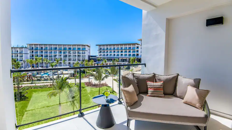 Private balcony overlooking the resort grounds from the Resort View Junior Suite King at Hyatt Zilara Cap Cana.
