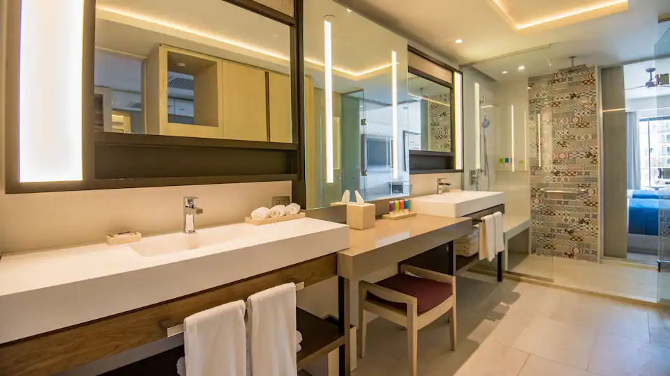 Resort View Junior Suite King bathroom with double vanity and walk-in shower at Hyatt Zilara Cap Cana.