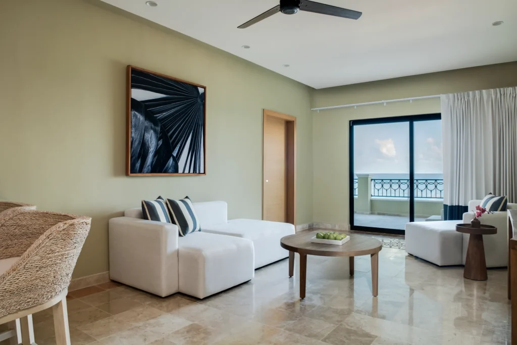 Club Level Master Suite Oceanfront King living room with sofa seating and balcony view at Hyatt Zilara Riviera Maya.