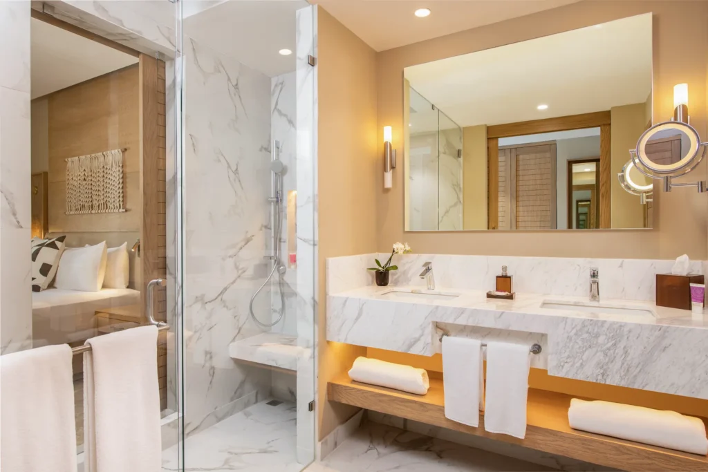 Club Level Junior Suite Oceanfront Private Pool King bathroom with double vanity and rain shower at Hyatt Zilara Riviera Maya.