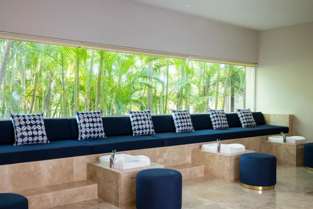 Pedicure stations with plush seating and tropical garden views at Hyatt Zilara Riviera Maya spa.