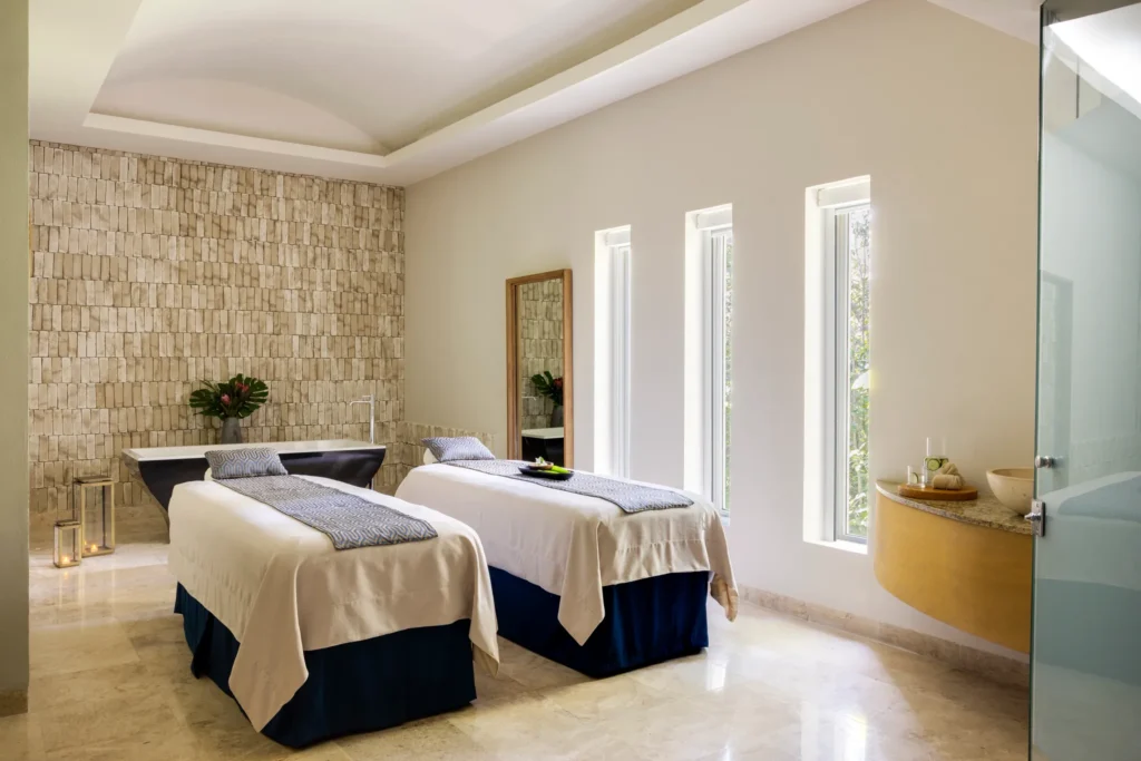 Dual massage tables in a serene spa treatment room at Hyatt Zilara Riviera Maya, designed for couples’ relaxation experience