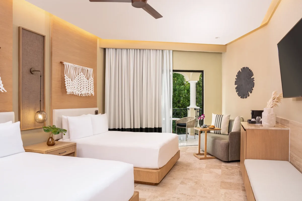 Junior Suite Tropical View with two double beds and private balcony at Hyatt Zilara Riviera Maya.