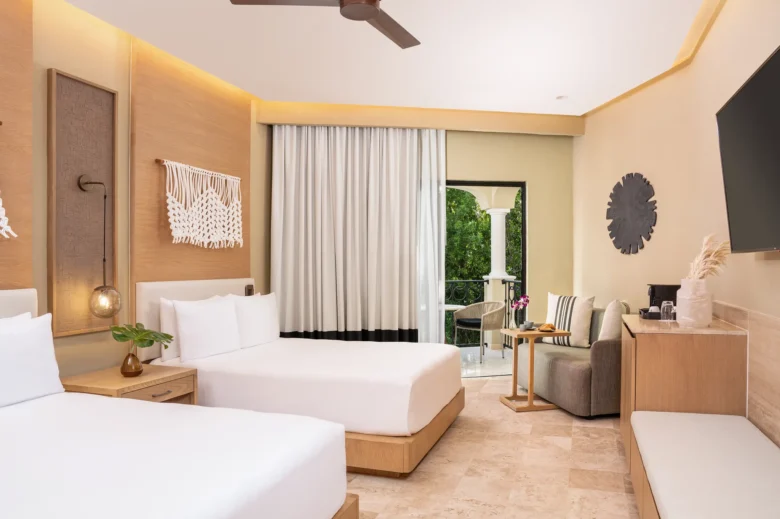 Junior Suite Tropical View with two double beds and private balcony at Hyatt Zilara Riviera Maya.