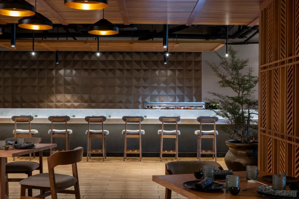 Tempest Asian restaurant at Hyatt Zilara Riviera Maya featuring a modern sushi bar, warm ambient lighting, and minimalist Japanese-inspired design.