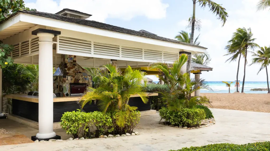 Open-air beachfront grill and dining venue surrounded by tropical landscaping at Hyatt Zilara Rose Hall in Montego Bay.