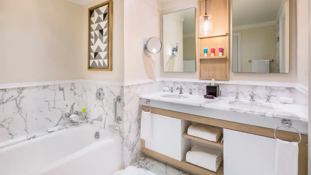 Oceanfront Double bathroom with marble vanity, soaking tub, and double sinks at Hyatt Zilara Rose Hall.