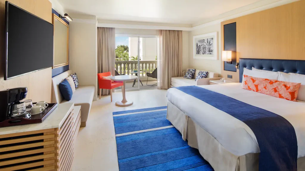 King room with plush king bed and furnished terrace at Hyatt Zilara Rose Hall.