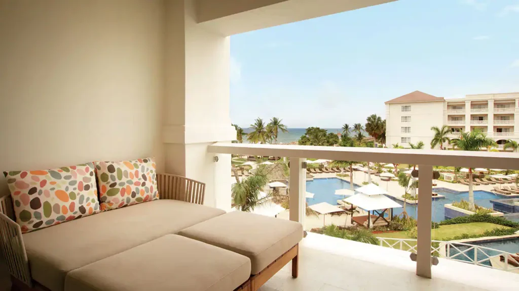 Ocean View Junior Suite King private terrace overlooking the pool and Caribbean Sea at Hyatt Zilara Rose Hall.