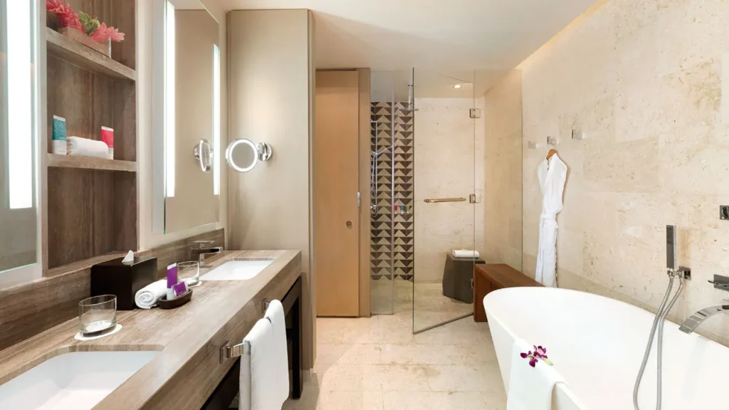 Swim-Up Junior Suite Double bathroom with soaking tub and rain shower at Hyatt Zilara Rose Hall.