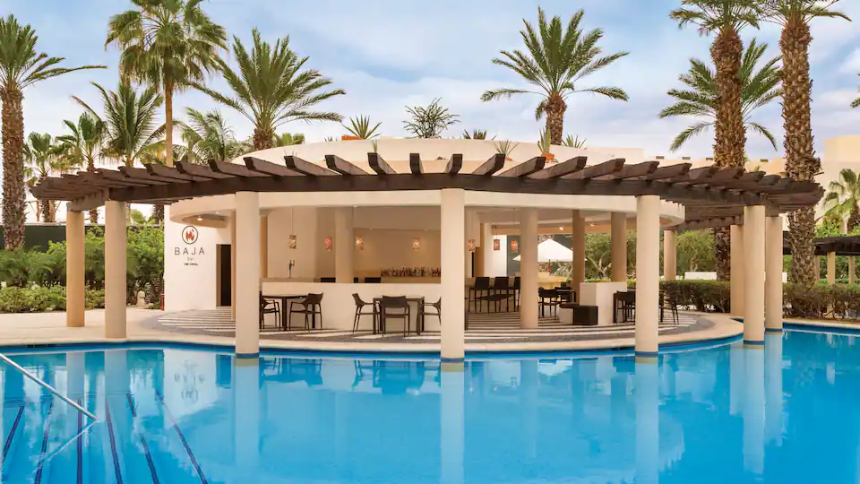 Baja Bar at Hyatt Ziva Los Cabos featuring a stylish swim-up bar, tropical cocktails, and relaxing poolside ambiance.
