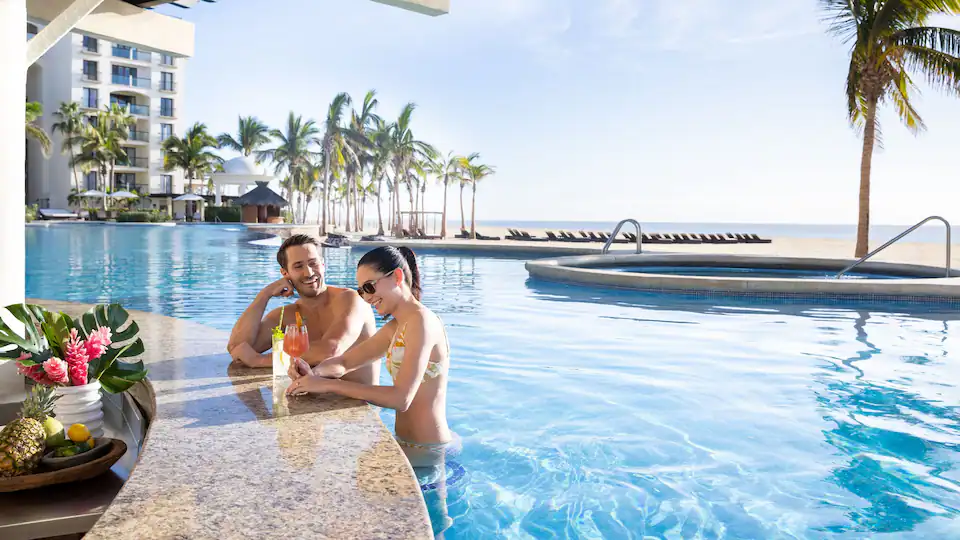 Bar Azul pool bar at Hyatt Ziva Los Cabos featuring a swim-up bar, tropical cocktails, and a relaxing poolside atmosphere.